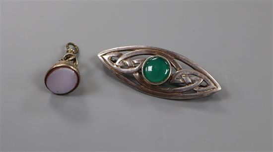 A Victorian engraved gold plated and sardonyx set fob seal, 23mm and an Art Nouveau style 925 and chrysophase brooch, 45mm.